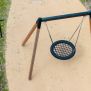 Single Swing (BNS 90cm) with a round netted seat suspended by chains on a wooden and metal frame.