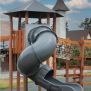 Khumbu castle with slide featuring a grey spiral tube slide and wooden play structure.