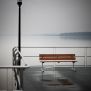 Bench, Steel Contruction with wooden seat and backrest on a pier next to a tall black lamp post